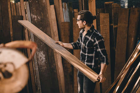 Professional Carpenter man authentic Handcraft  Wood worker. Joiner or furniture builder home diy projects maker male.の写真素材