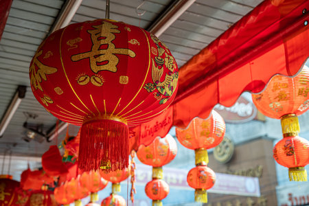 Yaowarat street during Chinese New Year festival celebrates holidays in Chinese culture shop sale red china traditional lantern clothes: 19 January 2023, Bangkok, THAILAND.のeditorial素材