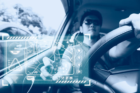 male car driver using GPS navigator system on hologram touch panel modern technology for transportation assistantの写真素材