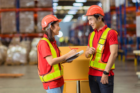 Asian factory warehouse staff worker enjoy working together. Cargo inventory shipping logistics team workの写真素材