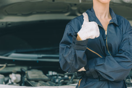 Mechanic Hand Thumbs Up Work in Auto Repair Shop Fix Car in Garage Maintenance Service in Good Condition Happy Liked at Workplaceの写真素材