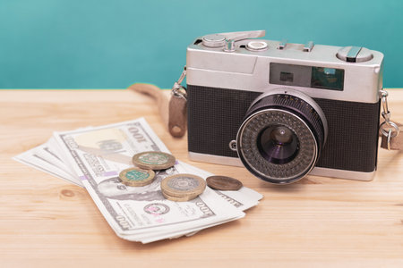vintage camera with fake money for sell photograph or stock image photographer business career conceptの写真素材