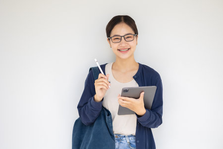 Happy university teen girl in school campus enjoy learning education Asian people female.の写真素材