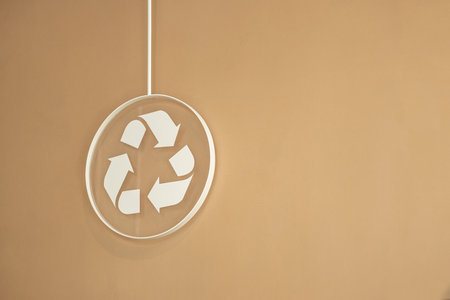 recycle sign on brown wall blank copy space for text modern design backgroundの写真素材
