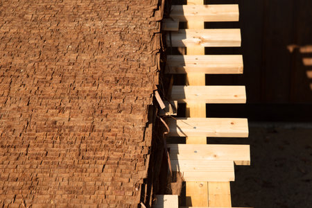 Closeup Hiwada buki roofing style traditional Japanese made from cedar or cypress layers bark thatching roof architectureの写真素材