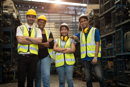 portrait group of engineer employee team staff group diversity worker together in dirty metal...