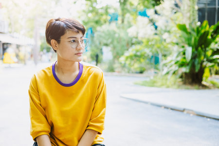 Portrait Southeast Asian LGBT transgender woman or young girl short hair happy smile.の写真素材