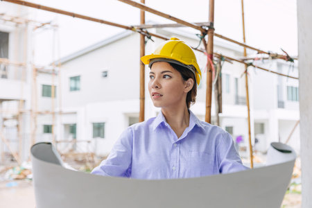 Smart woman engineer worker builder worker in construction site. Architect home project chief...