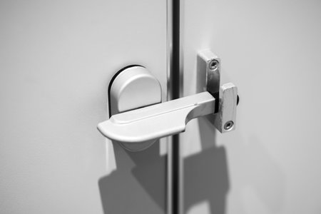 Public bathroom door latch,  Toilet Door Lock closeup.の写真素材