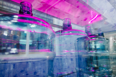 drink water factory using UV light disinfection sterilization system in production line to clean drinking water bottle tankの写真素材