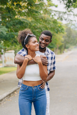 Date couple man and women valentine day. African black lover at park outdoors summer season vintage...