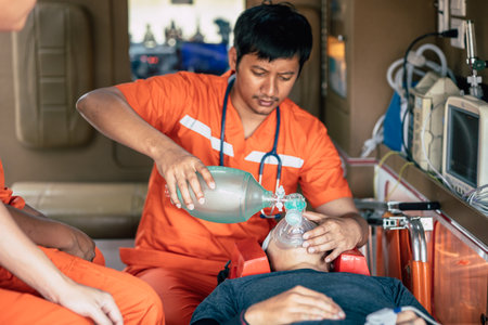 paramedic mobile car medical emergency team working in action help first aid save people life at accident site outdoorsの写真素材