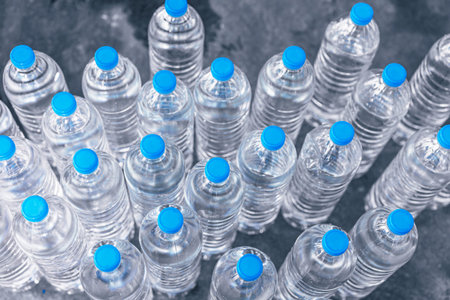 Group of PET plastic bottles of drinking water in water plant factoryの写真素材