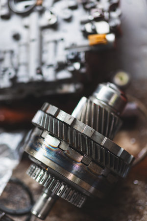 Closeup Motor Engine Clutch Gear, Auto Garage Motor racing part service workshop. vertical shot.