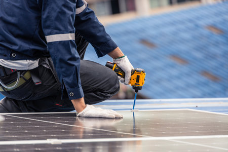 Professional Engineer Service Solar Panel. Worker Maintenance Cleaning Replacing Solar Panel. Solar photovoltaic panel system in Industry roof. Saving Energy with Clean Power.の写真素材
