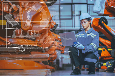 Engineer Staff Using Laptop Computer Technology Software Program Robot In Robotic Industry Factory overlay modern graphics HUD.の写真素材