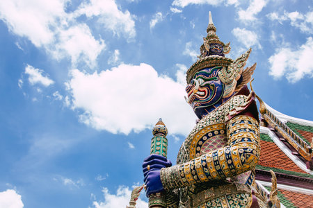 Thai Giant baton gate keeper at Wat Phra Kaew Temple Art statue, Bangkok tourist landmark.