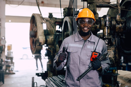 portrait professional worker working in heavy metal industry factory happy smiling enjoy working