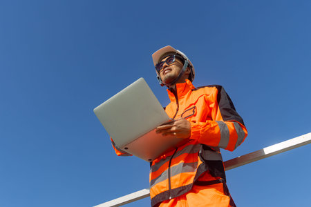 Asian engineer advance technology technician mechanic male standing happy smiling looking for future...