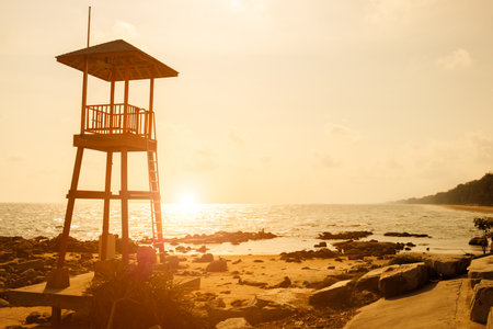 Beach Guard, Life guard watch tower building at dangerous seaside against sunset sky backgroundの写真素材