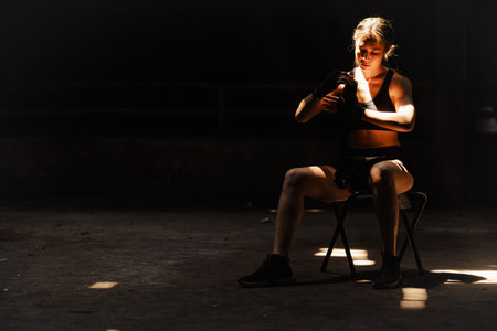 Muay thai, strong women fighter wrapped fist to Bare Knuckle traditional art of fighting Asian style...