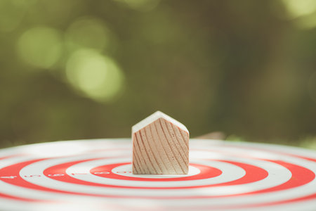 home at the center of target for property investment goal aim in business house owner conceptの写真素材