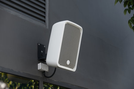 Outdoor Speaker System installed at balcony wall backyard for exterior music audio system public...