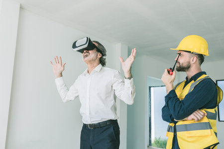 Construction manager happy exciting using VR visual reality presentation technology device present...
