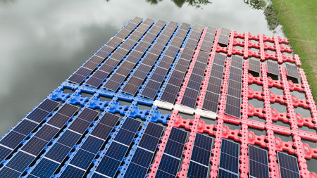 Drone view of Floating Solar Panel. Solar photovoltaic panel PV System in Industry lake water pond....