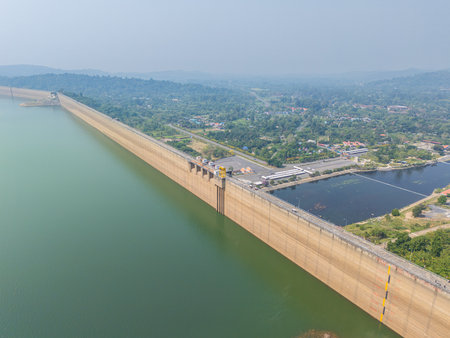 Khuean Khun Dan Prakanchon Dam in Thailand with low water level reserved in dry summer seasonの写真素材