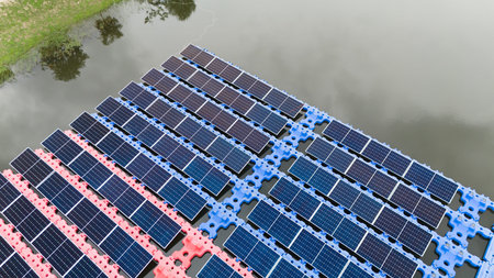 Drone view of Floating Solar Panel. Solar photovoltaic panel PV System in Industry lake water pond....