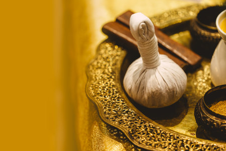 Thai herb for spa and massage aromatherapy background, Thai Herbal compress ball with herbal mix with copy space for textの写真素材