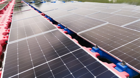 Drone view of Floating Solar Panel. Solar photovoltaic panel PV System in Industry lake water pond....