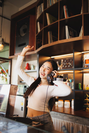 DJ Asian women young teen with music player, party sound entertainment happy smiling expressionの写真素材