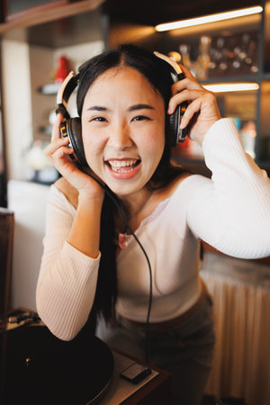 DJ Asian women young teen with music player, party sound entertainment happy smiling expressionの写真素材