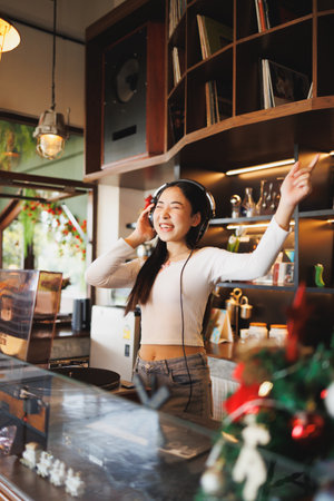 DJ Asian women young teen with music player, party sound entertainment happy smiling expressionの写真素材