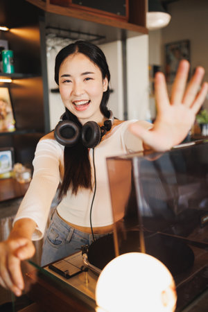 DJ Asian women young teen with music player, party sound entertainment happy smiling expressionの写真素材