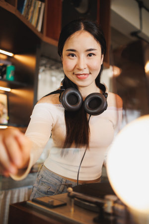 DJ Asian women young teen with music player, party sound entertainment happy smiling expressionの写真素材