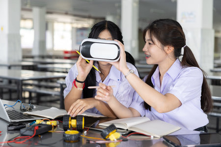 Smart Students teen in uniform learning STEM with VR headset technology future learning device at...