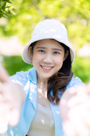 Beautiful Asian teen girl cute lovely happy smiling. portrait women outdoor nature healthy femaleの写真素材