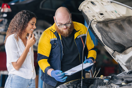 Garage Customer Happy, Car owner smiling mechanic talking explain. Satisfied car service in garage workshop, Good car service center.