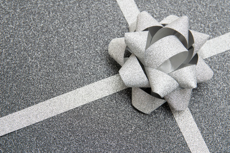 black gift box with silver ribbonの写真素材