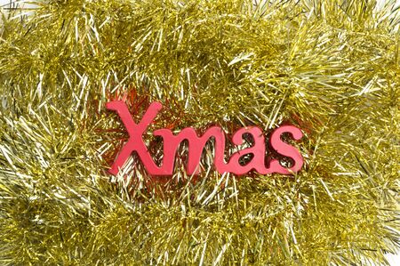 X-mas text on yellow christmas decorationの写真素材
