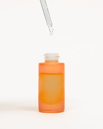 cosmetic bottle with dropper isolated on a white background, beauty treatment