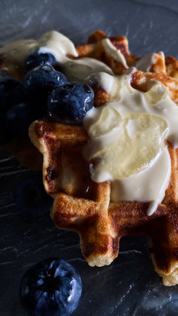 Waffles with cream and blueberriesの写真素材