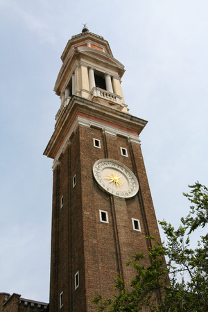 Venice, bell tower clock in Campo Santi Apostoliの写真素材