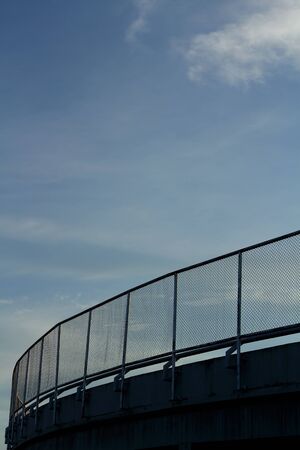 Mesh fence and skyの写真素材