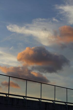 Mesh fence and skyの写真素材