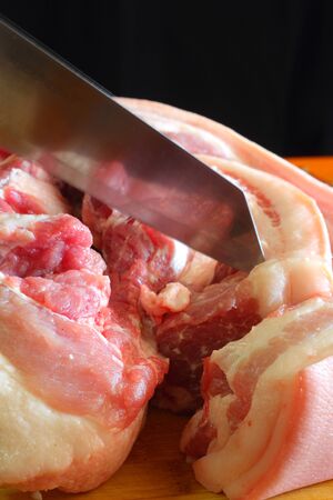 Streaky pork and knife の写真素材