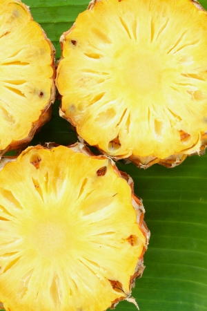 Pineapple on banana leaves の写真素材